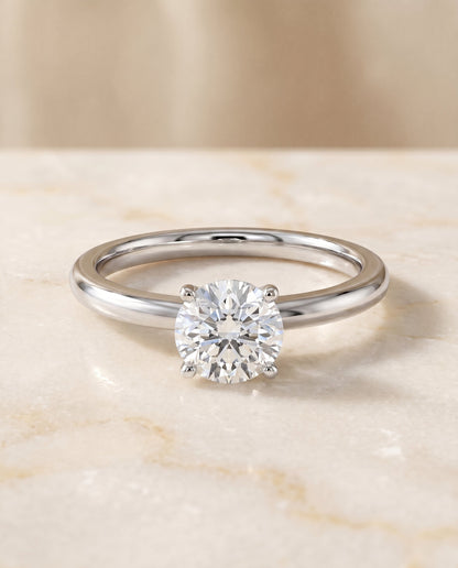 Isolde Select Knife Edge Solitaire Round Lab Diamond Engagement Ring in Platinum, shown on hand, angled | RockHer
