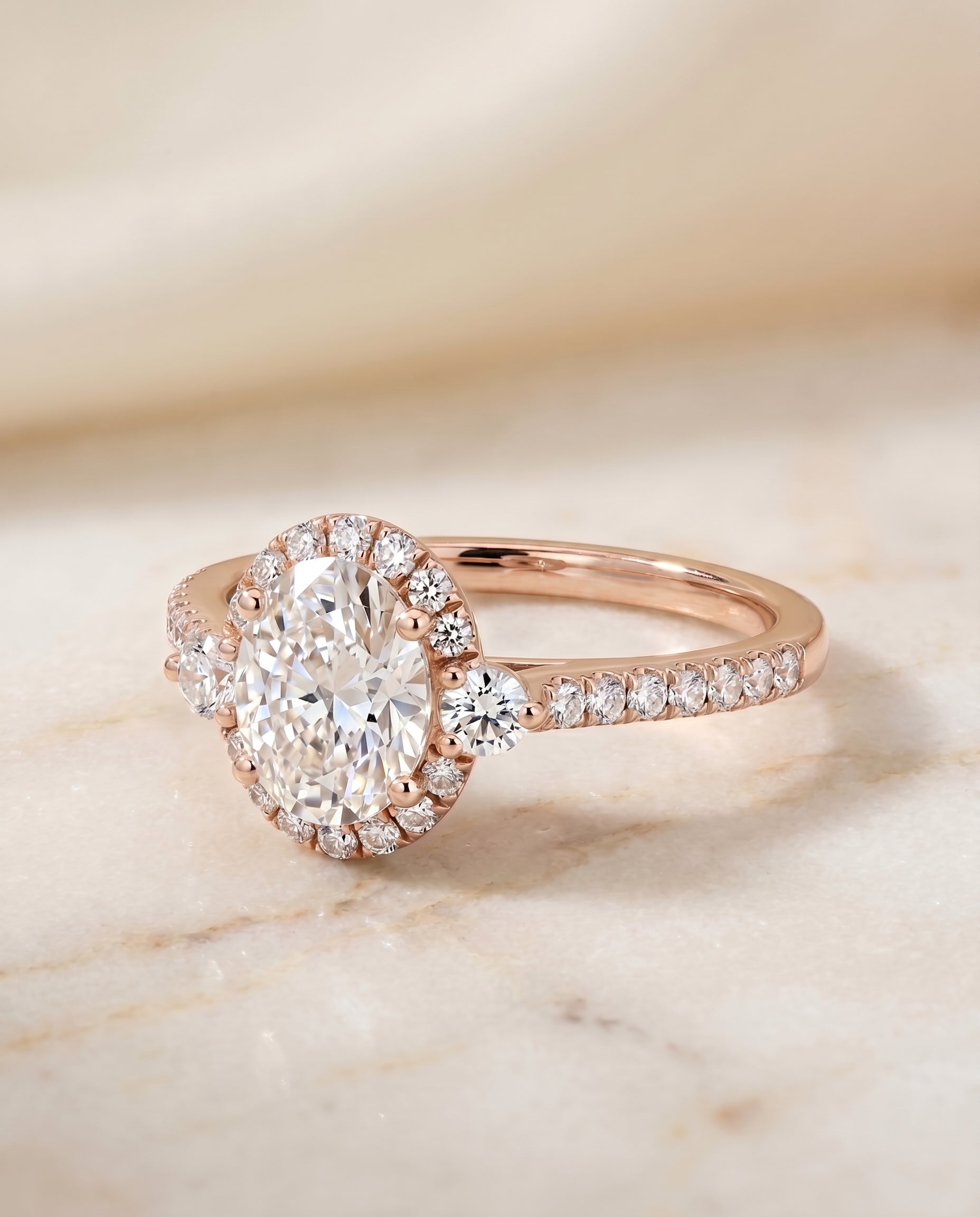 Ivy Select Halo Oval Lab Diamond Engagement Ring in 14K Rose Gold, shown on hand, angled | RockHer