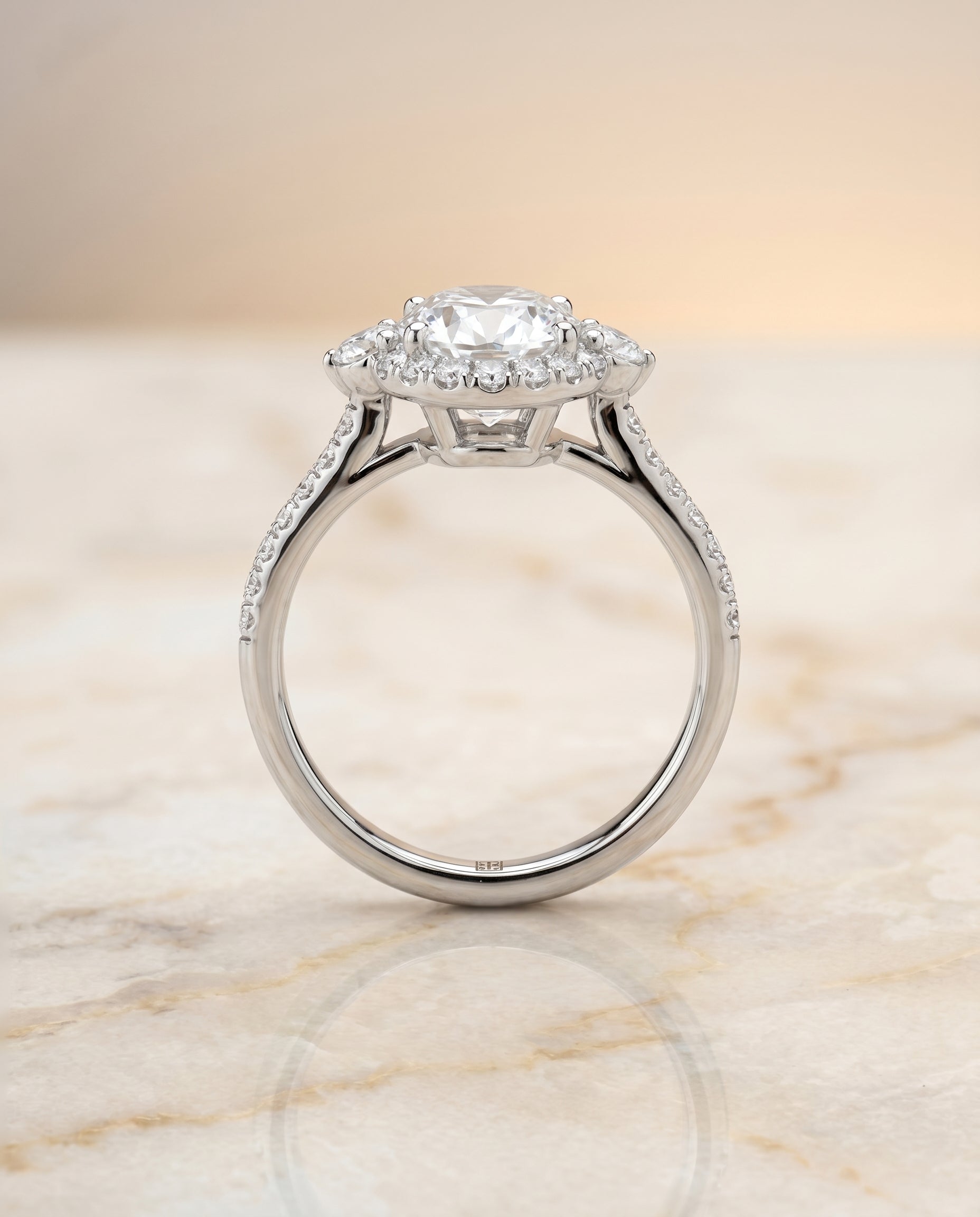 The Ivy three stone delicate halo engagement ring setting, shown in Platinum | RockHer