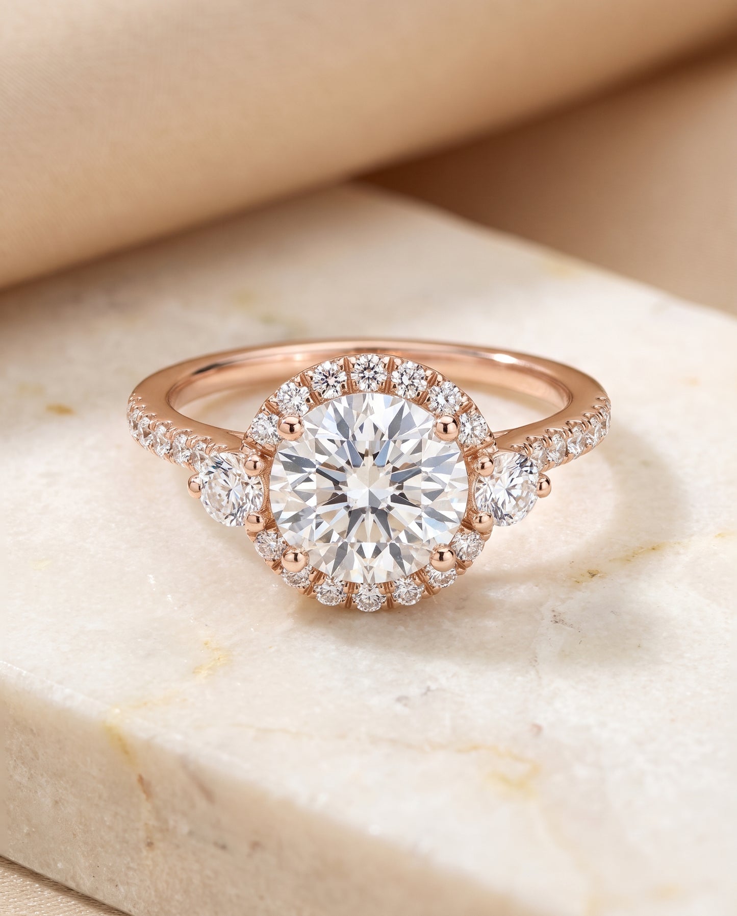 The Ivy Three Stone Delicate Halo Round Engagement Ring Setting in 14K Rose Gold