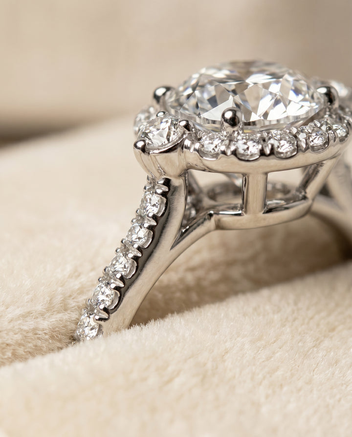 The Ivy Three Stone with Halo Engagement Ring Setting for Round Diamonds in Platinum