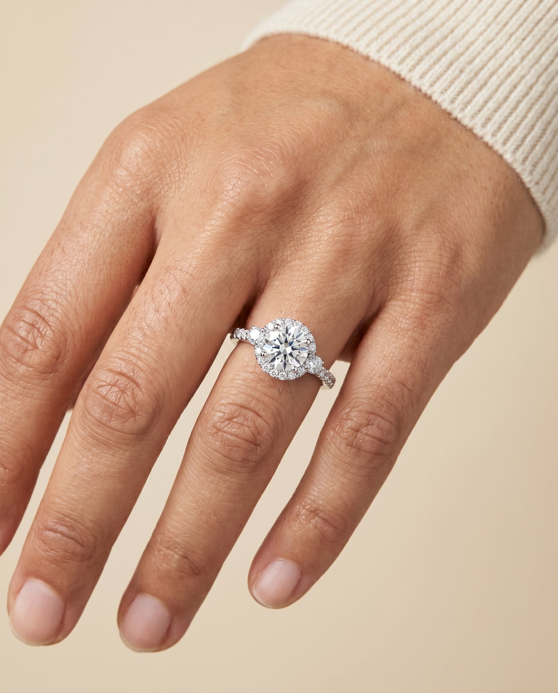 Ivy Select Halo Round Lab Diamond Engagement Ring in Platinum, shown on hand | RockHer
