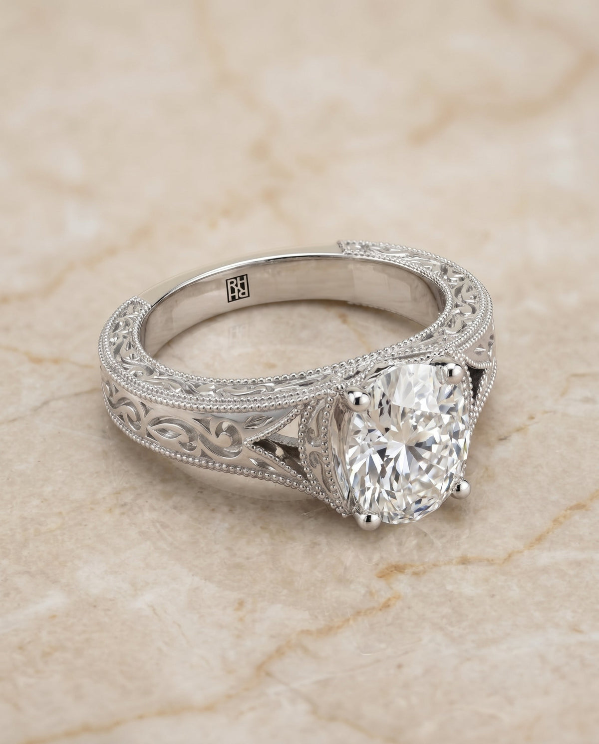 Janis Select Vintage Solitaire Oval Lab Diamond Engagement Ring in 18K White Gold, shown on hand, angled | RockHer