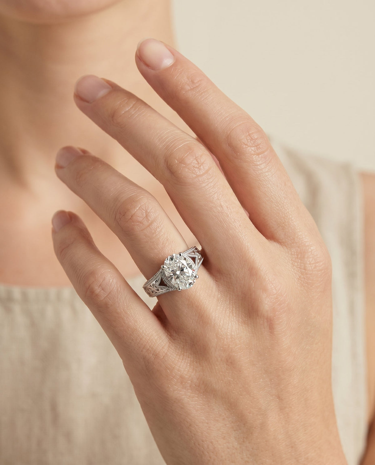Janis Select Vintage Solitaire Oval Lab Diamond Engagement Ring in 18K White Gold, shown on hand | RockHer