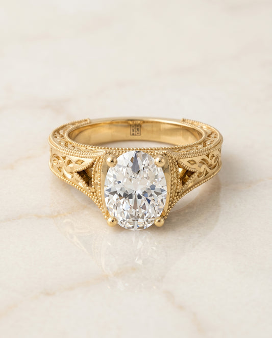 The Janis Solitaire Engagement Ring Setting for Oval Diamonds in 18K Yellow Gold