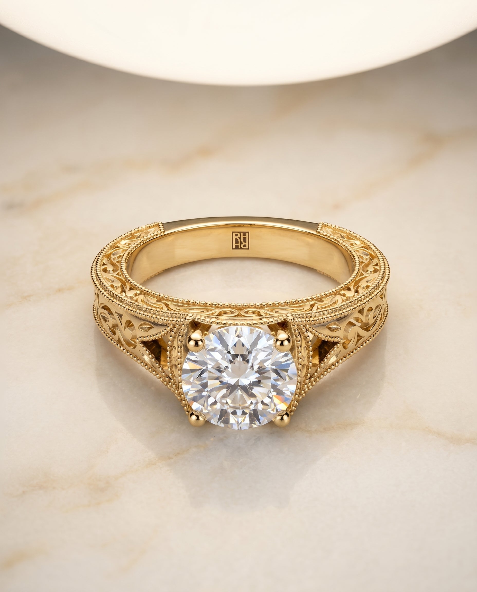 The Janis Solitaire Engagement Ring Setting for Round Diamonds in 18K Yellow Gold