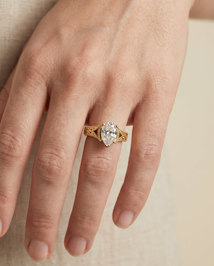 Janis Select Vintage Solitaire Pear Lab Diamond Engagement Ring in 18K Yellow Gold, shown on hand | RockHer