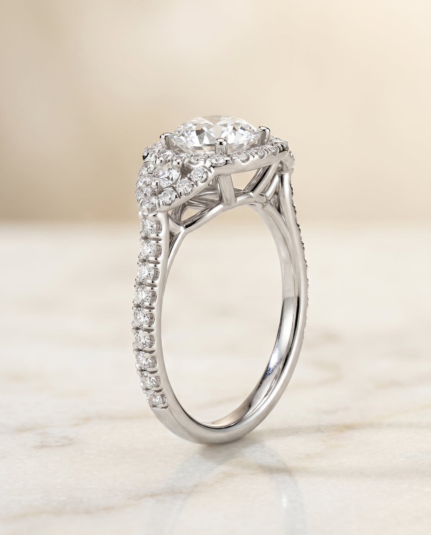 The Jennifer Three Stone with Halo Engagement Ring Setting for Round Diamonds in Platinum