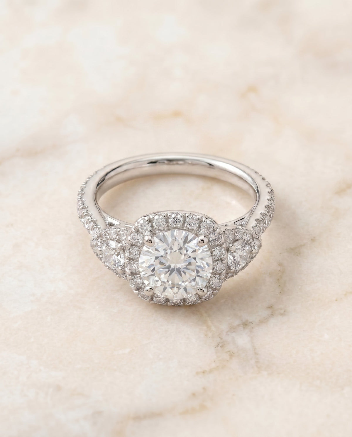Jennifer Select Three Stone Round Lab Diamond Engagement Ring in 18K White Gold, shown on hand, angled | RockHer