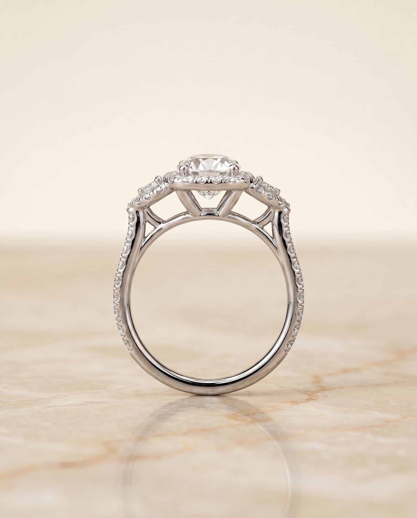 The Jennifer Three Stone with Halo Engagement Ring Setting for Round Diamonds in Platinum