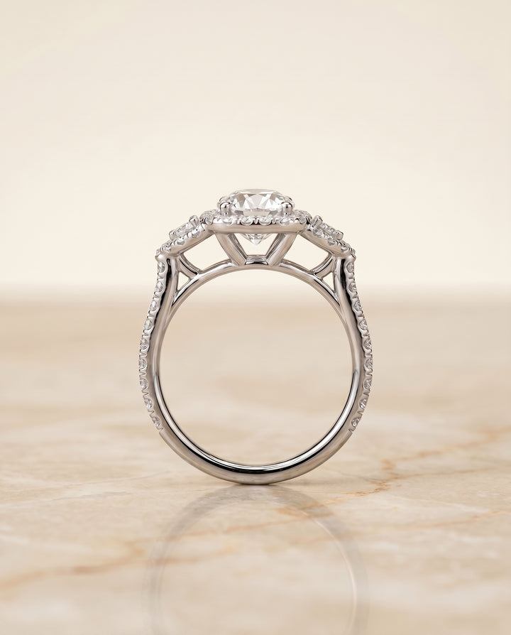 The Jennifer Three Stone with Halo Engagement Ring Setting for Round Diamonds in Platinum