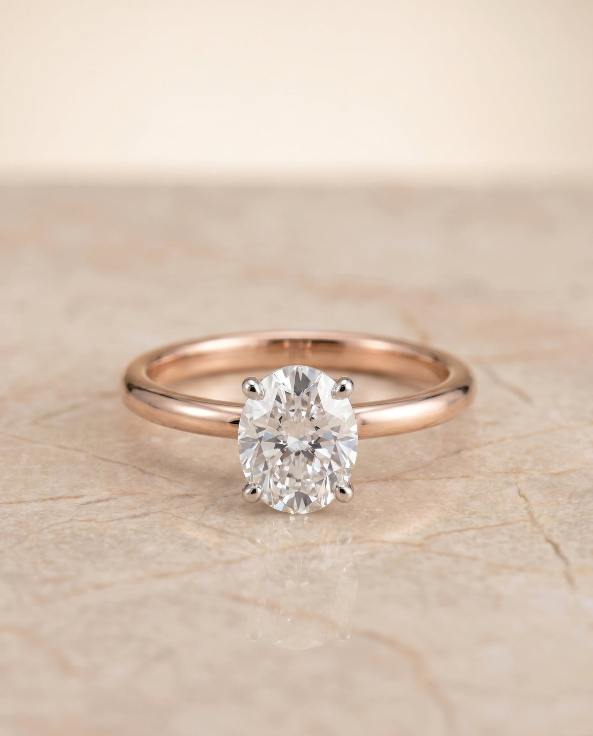 Joni Select Hidden Halo Oval Lab Diamond Engagement Ring in 14K Rose Gold, shown on hand, angled | RockHer