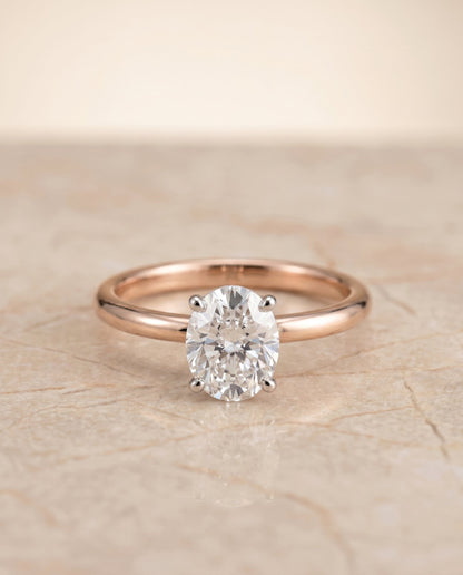 Joni Select Hidden Halo Oval Lab Diamond Engagement Ring in 14K Rose Gold, shown on hand, angled | RockHer