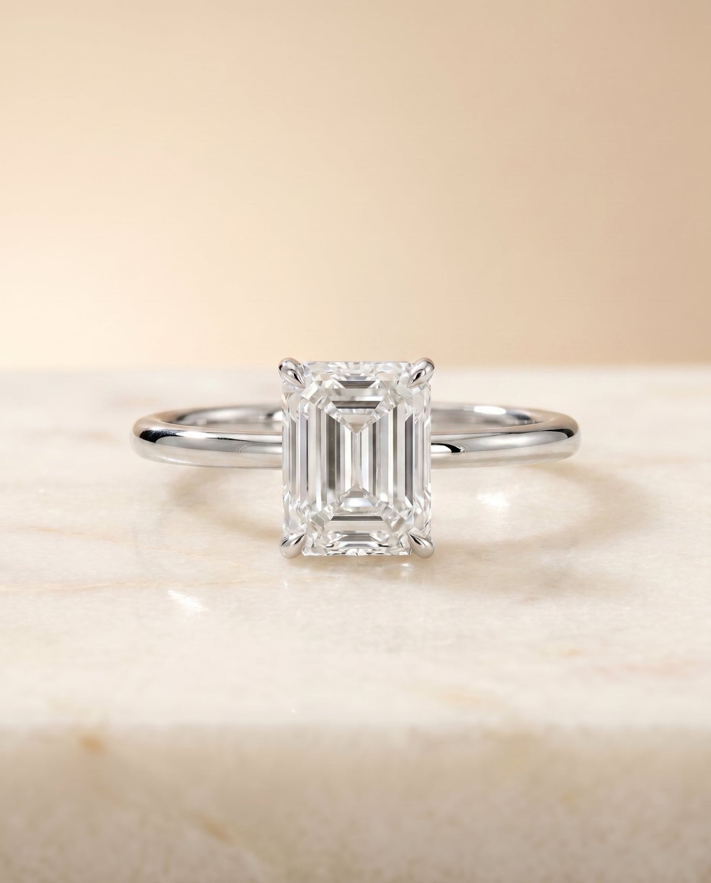 Joni Select Hidden Halo Radiant Cut Lab Diamond Engagement Ring in Platinum, shown on hand, angled | RockHer