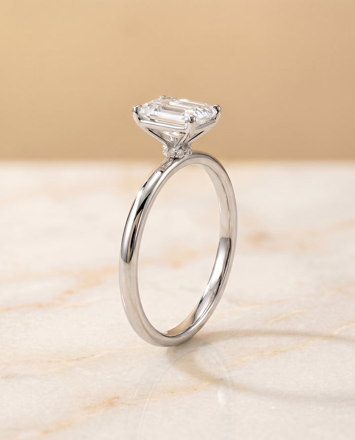 The Joni Hidden Halo Solitaire Engagement Ring Setting for Emerald Cut Diamonds in Platinum