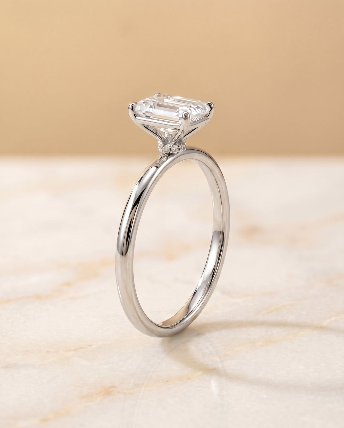 Select Hidden Halo Cut styling on The Joni emerald engagement ring setting | RockHer
