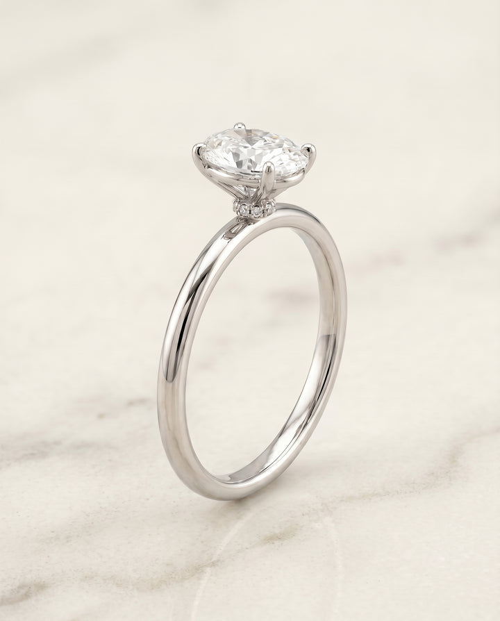 The Joni Hidden Halo Solitaire Engagement Ring Setting for Oval Diamonds in Platinum