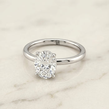 The Joni Hidden Halo Solitaire Oval Engagement Ring Setting in Platinum