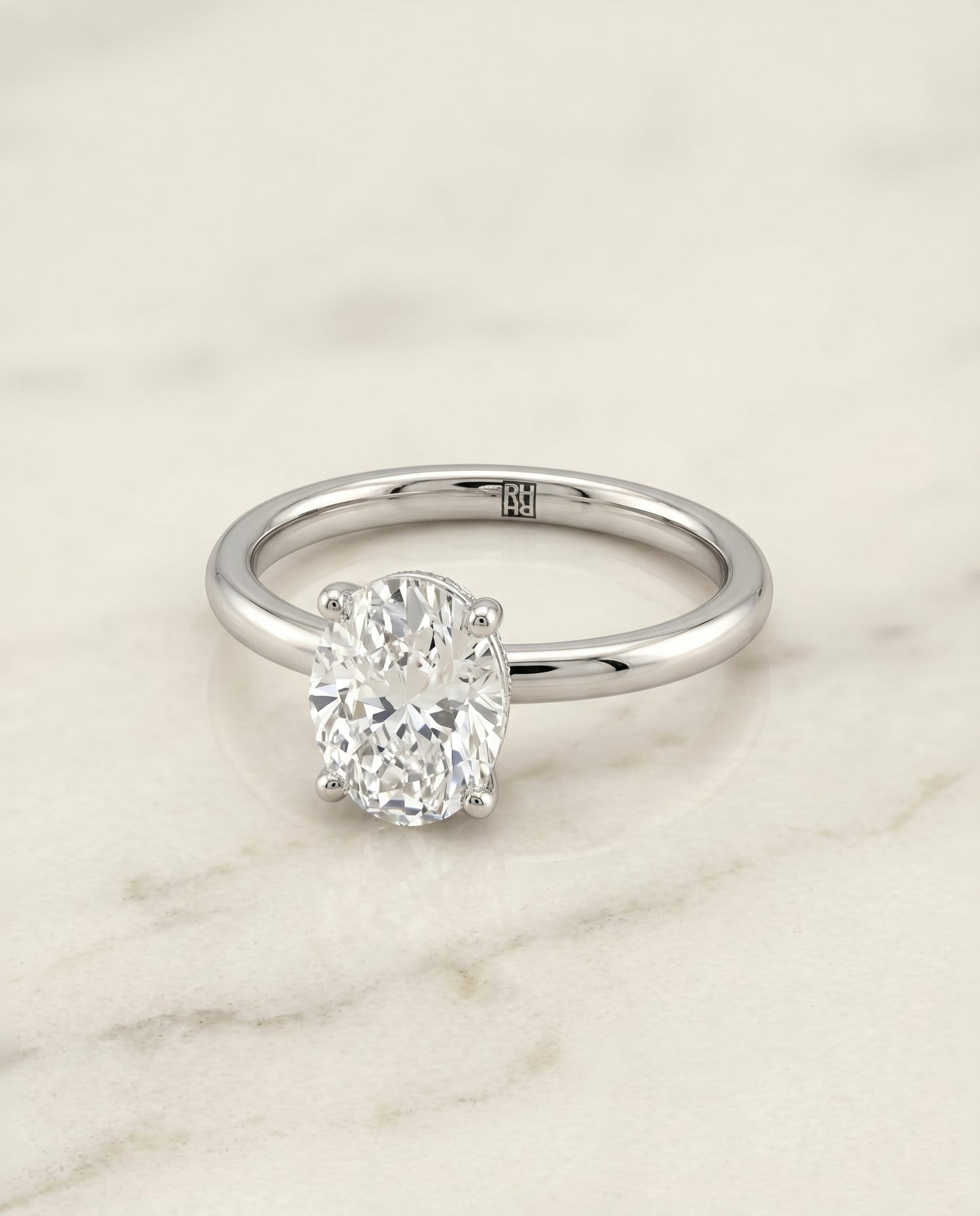 The Joni Hidden Halo Solitaire Engagement Ring Setting for Oval Diamonds in Platinum