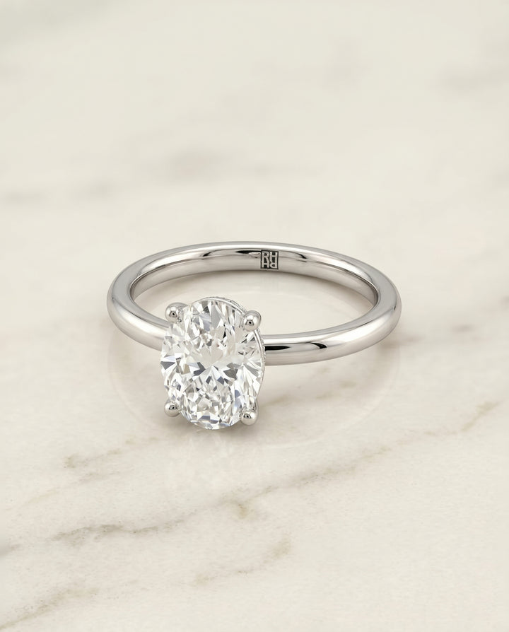 The Joni Hidden Halo Solitaire Oval Engagement Ring Setting in Platinum