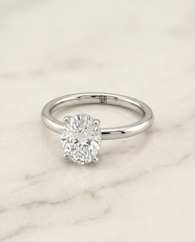 The Joni Hidden Halo Solitaire Oval Engagement Ring Setting in Platinum