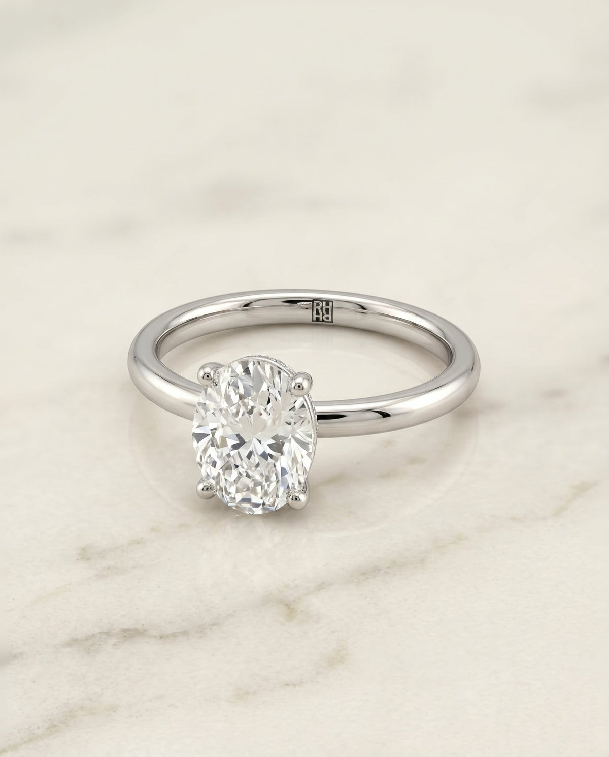 Joni Select Hidden Halo Oval Lab Diamond Engagement Ring in Platinum, shown on hand, angled | RockHer