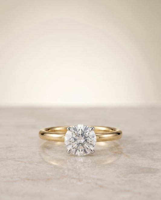 The Joni Hidden Halo Solitaire Engagement Ring Setting for Round Diamonds in 18K Yellow Gold