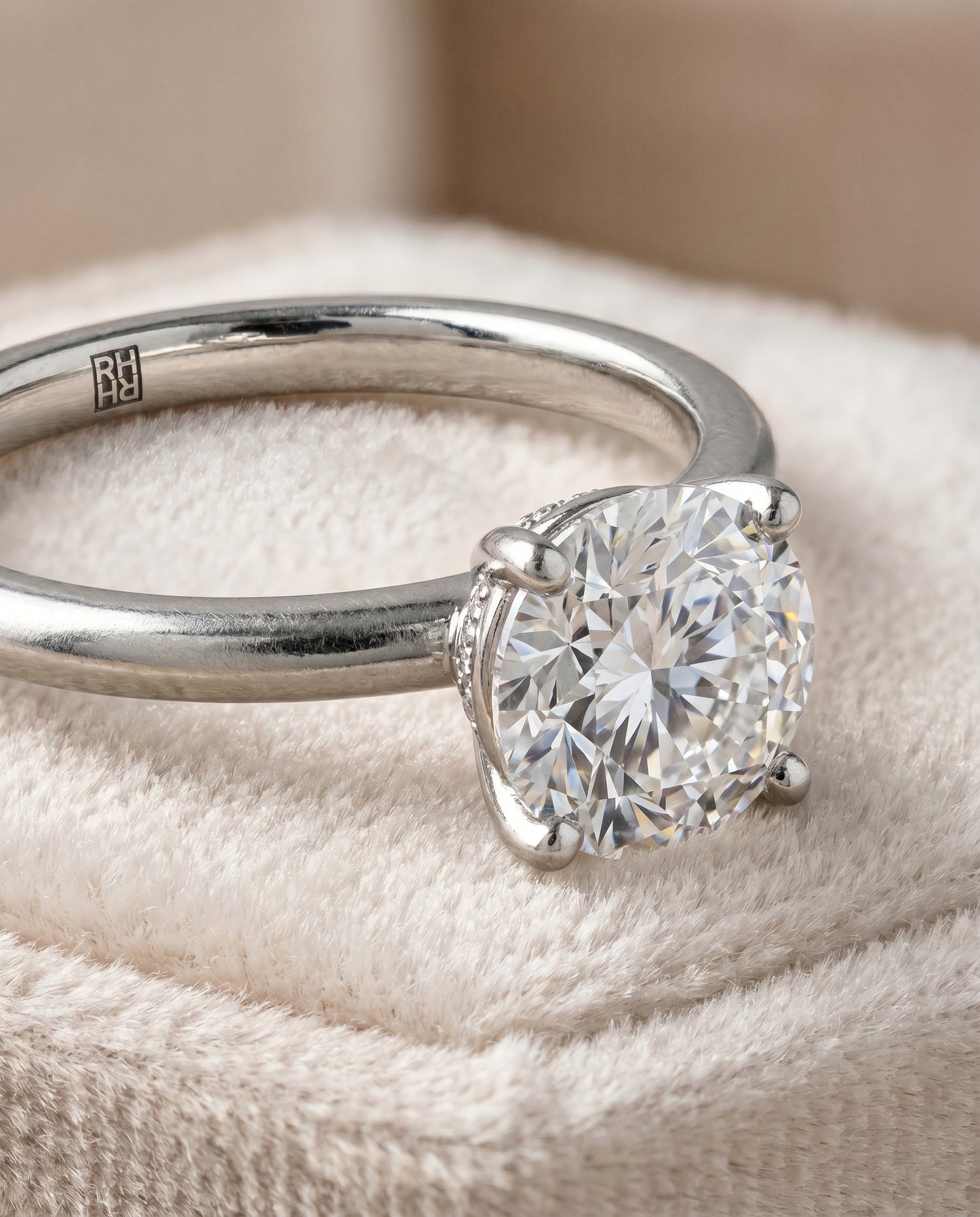 The Joni Hidden Halo Solitaire Engagement Ring Setting for Round Diamonds in Platinum