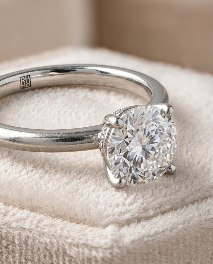 The Joni Hidden Halo Solitaire Engagement Ring Setting for Round Diamonds in Platinum