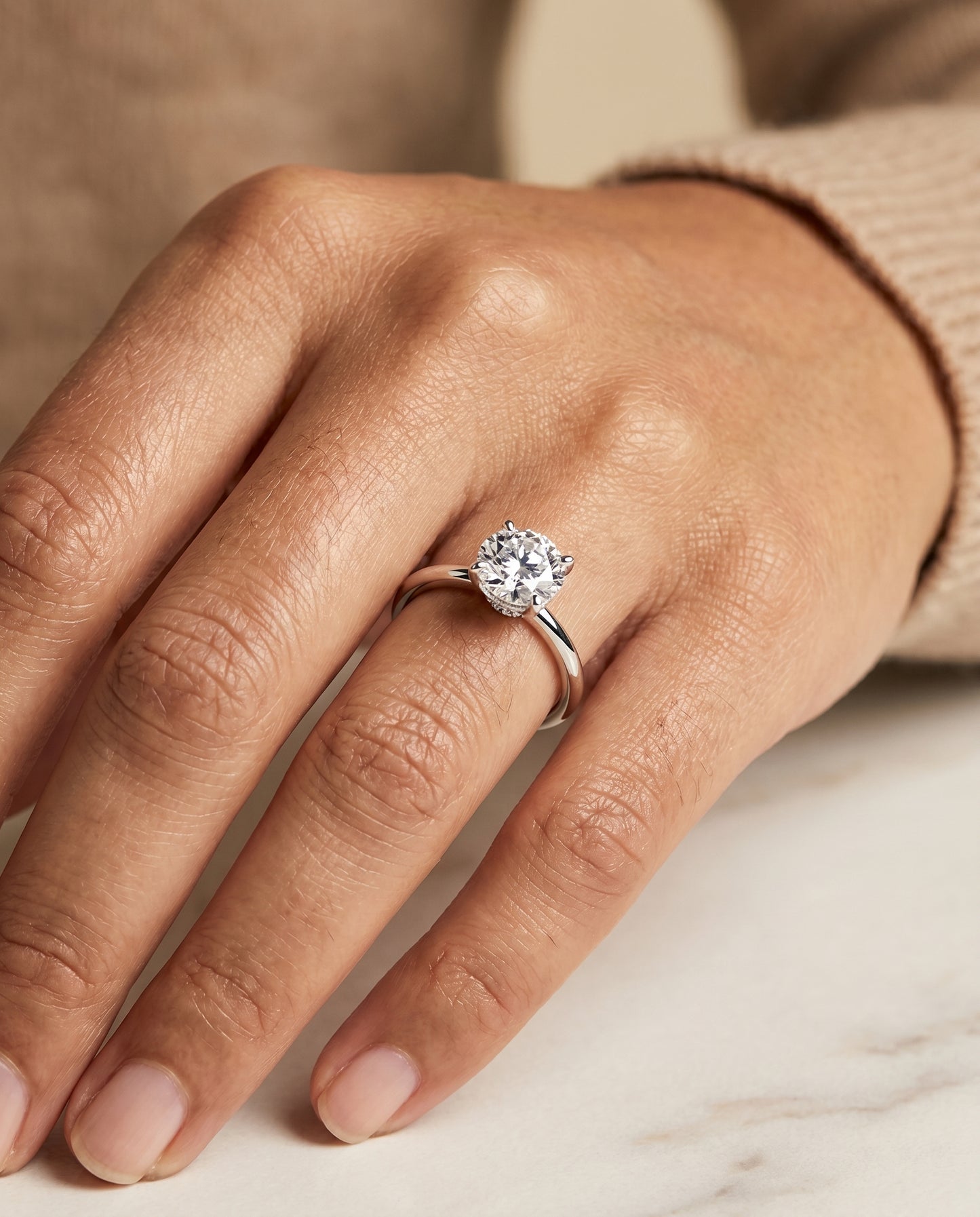 The Joni Hidden Halo Solitaire Engagement Ring Setting for Round Diamonds in Platinum