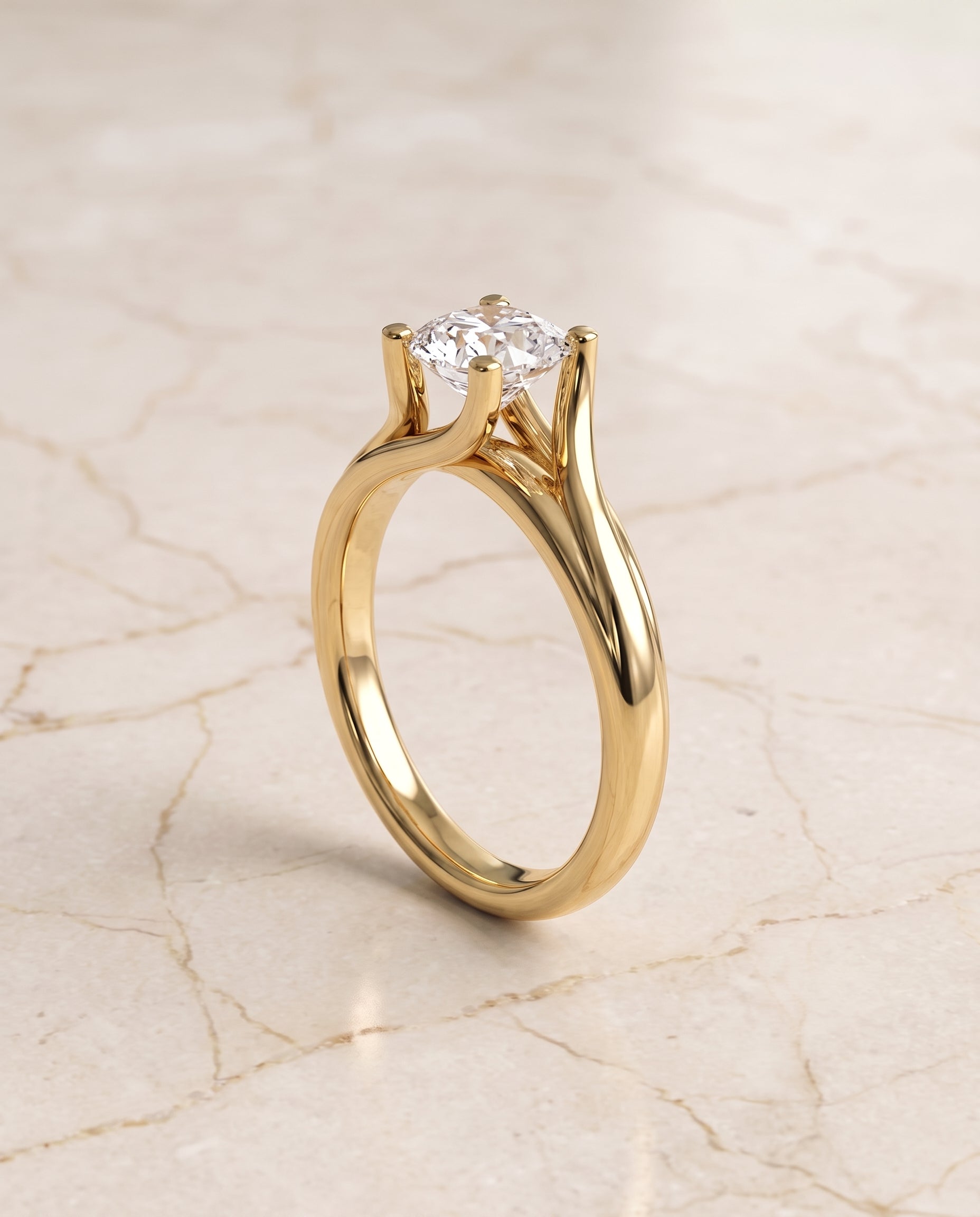 The Joplin Twisted Bypass Solitaire Cushion Cut Engagement Ring Setting in 18K Yellow Gold