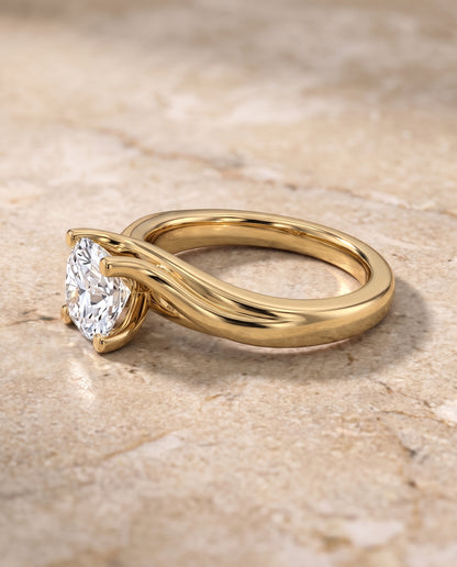 The Joplin Twisted Bypass Solitaire Cushion Cut Engagement Ring Setting in 18K Yellow Gold