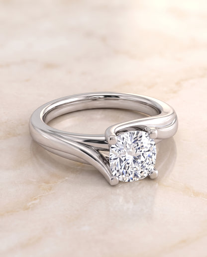 The Joplin Twisted Bypass Solitaire Cushion Cut Engagement Ring Setting in Platinum
