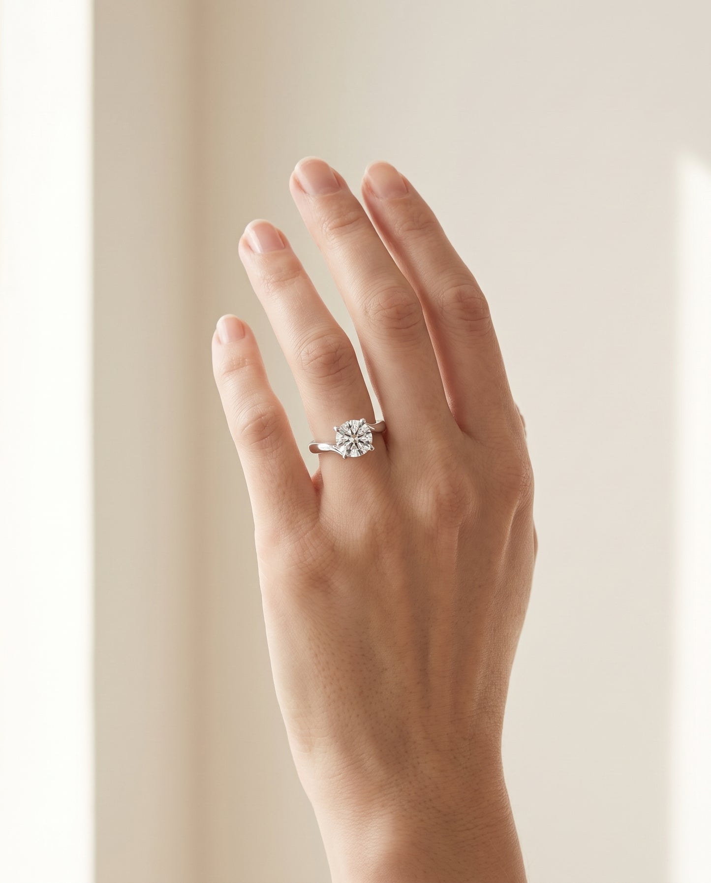 The Joplin Twisted Bypass Solitaire Cushion Cut Engagement Ring Setting in Platinum