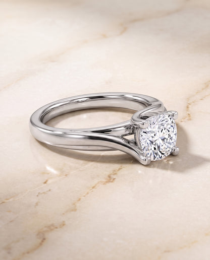 The Joplin Twisted Bypass Solitaire Cushion Cut Engagement Ring Setting in Platinum