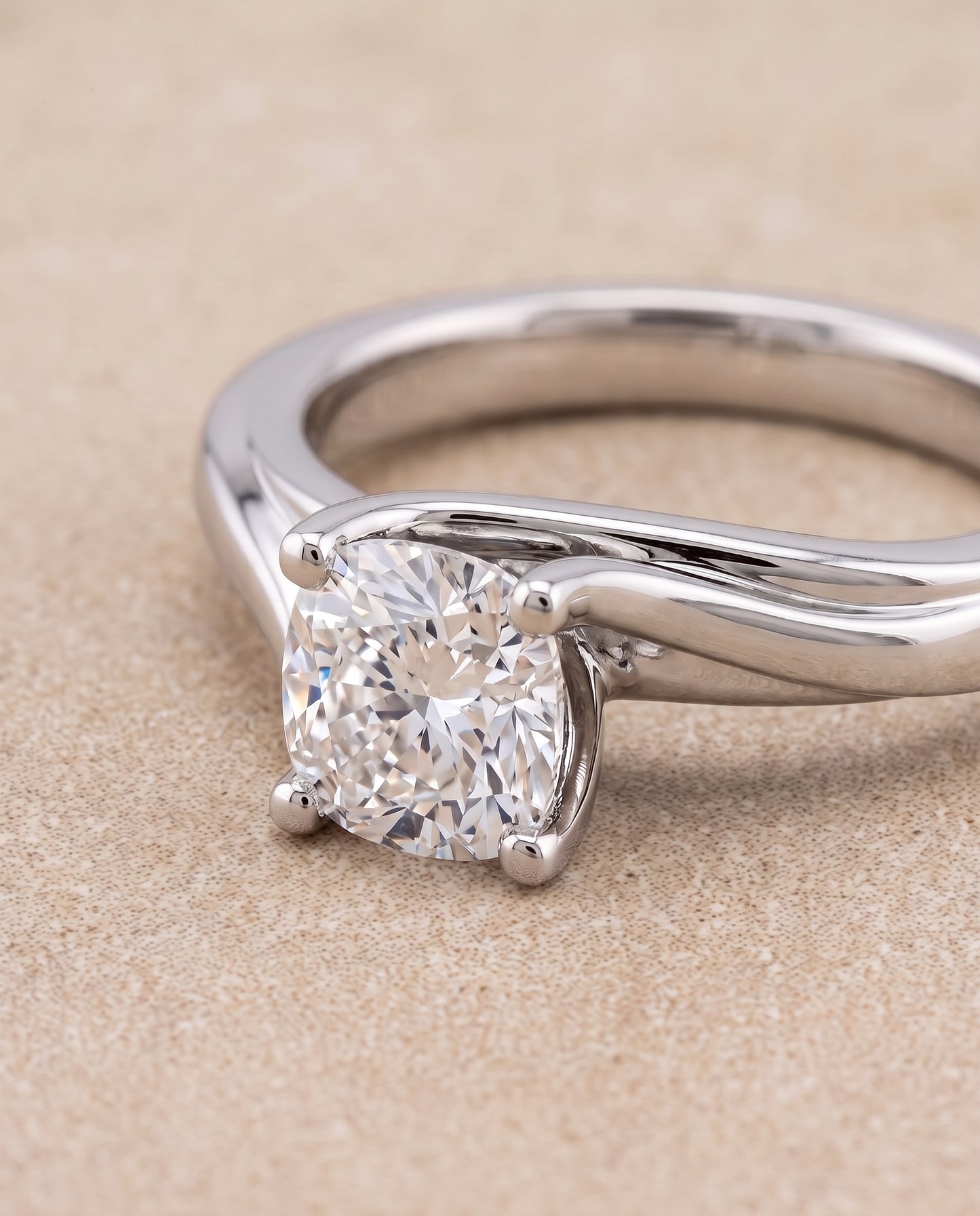 The Joplin Twisted Bypass Solitaire Cushion Cut Engagement Ring Setting in Platinum