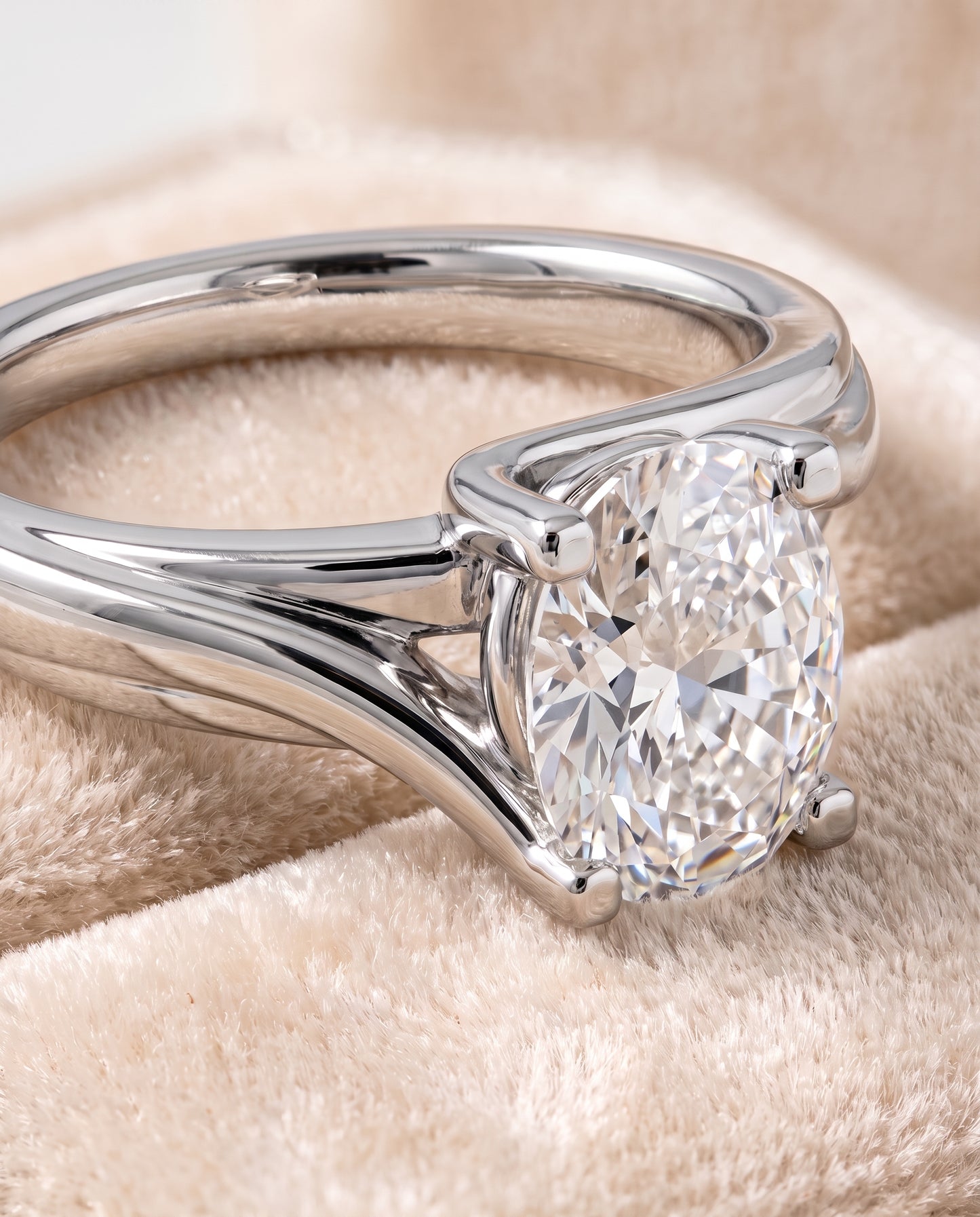The Joplin Twisted Bypass Solitaire Oval Engagement Ring Setting in 18K White Gold