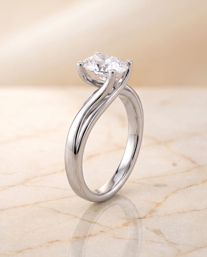 The Joplin Twisted Bypass Solitaire Oval Engagement Ring Setting in 18K White Gold