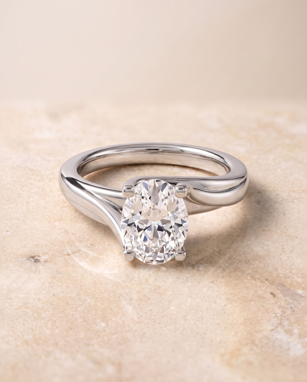 The Joplin Twisted Bypass Solitaire Oval Engagement Ring Setting in 18K White Gold