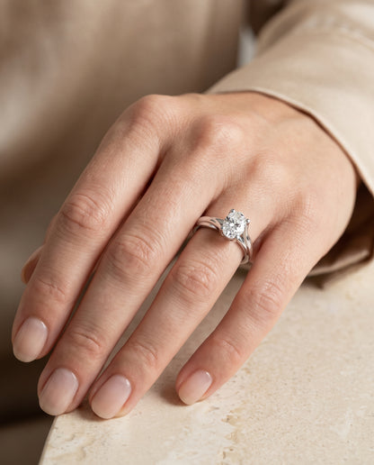 The Joplin Twisted Bypass Solitaire Oval Engagement Ring Setting in 18K White Gold