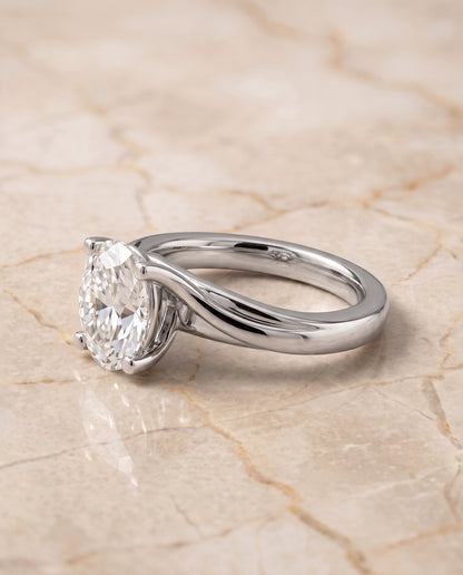 The Joplin Twisted Bypass Solitaire Oval Engagement Ring Setting in 18K White Gold