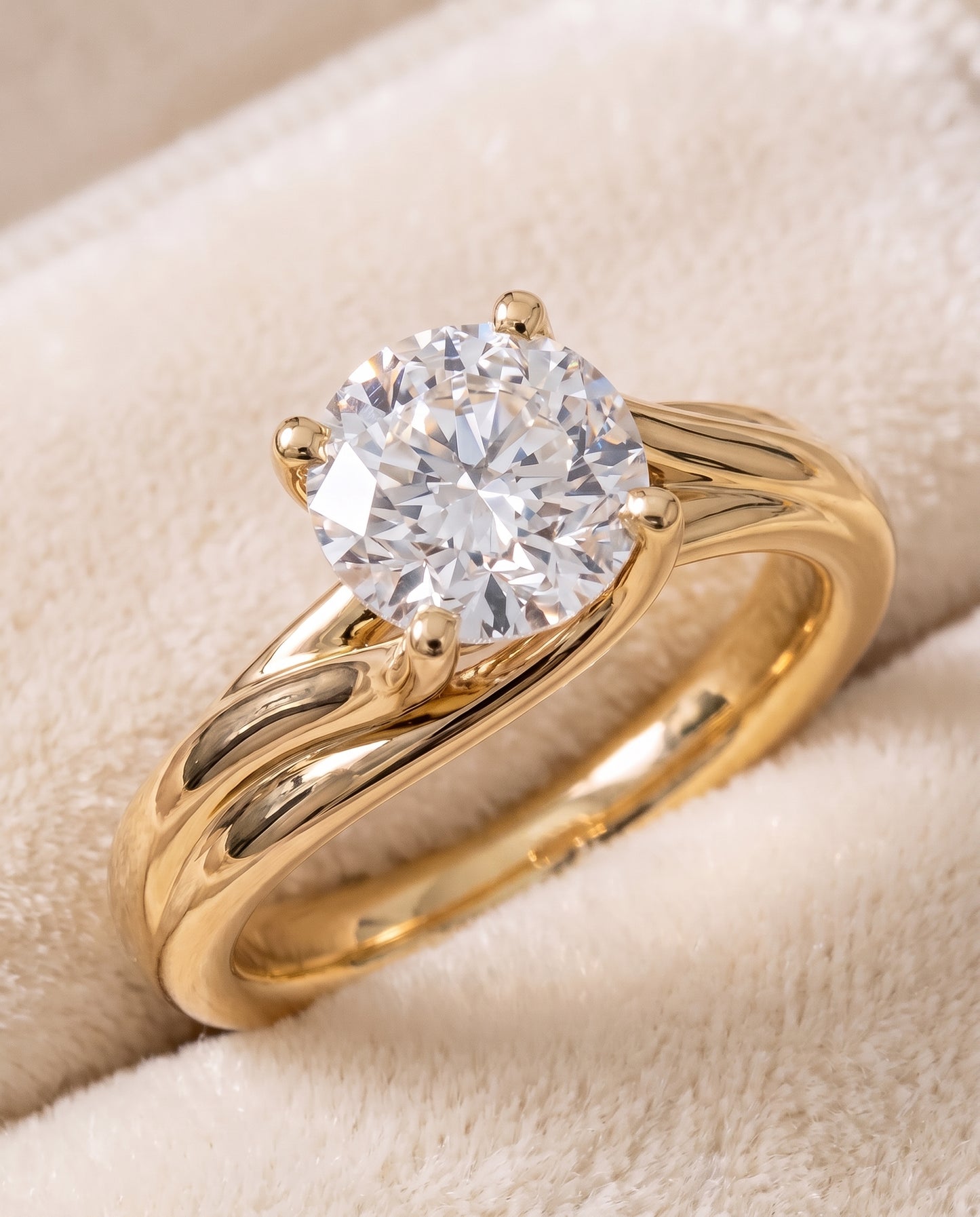 The Joplin Twisted Bypass Solitaire Round Engagement Ring Setting in 18K Yellow Gold