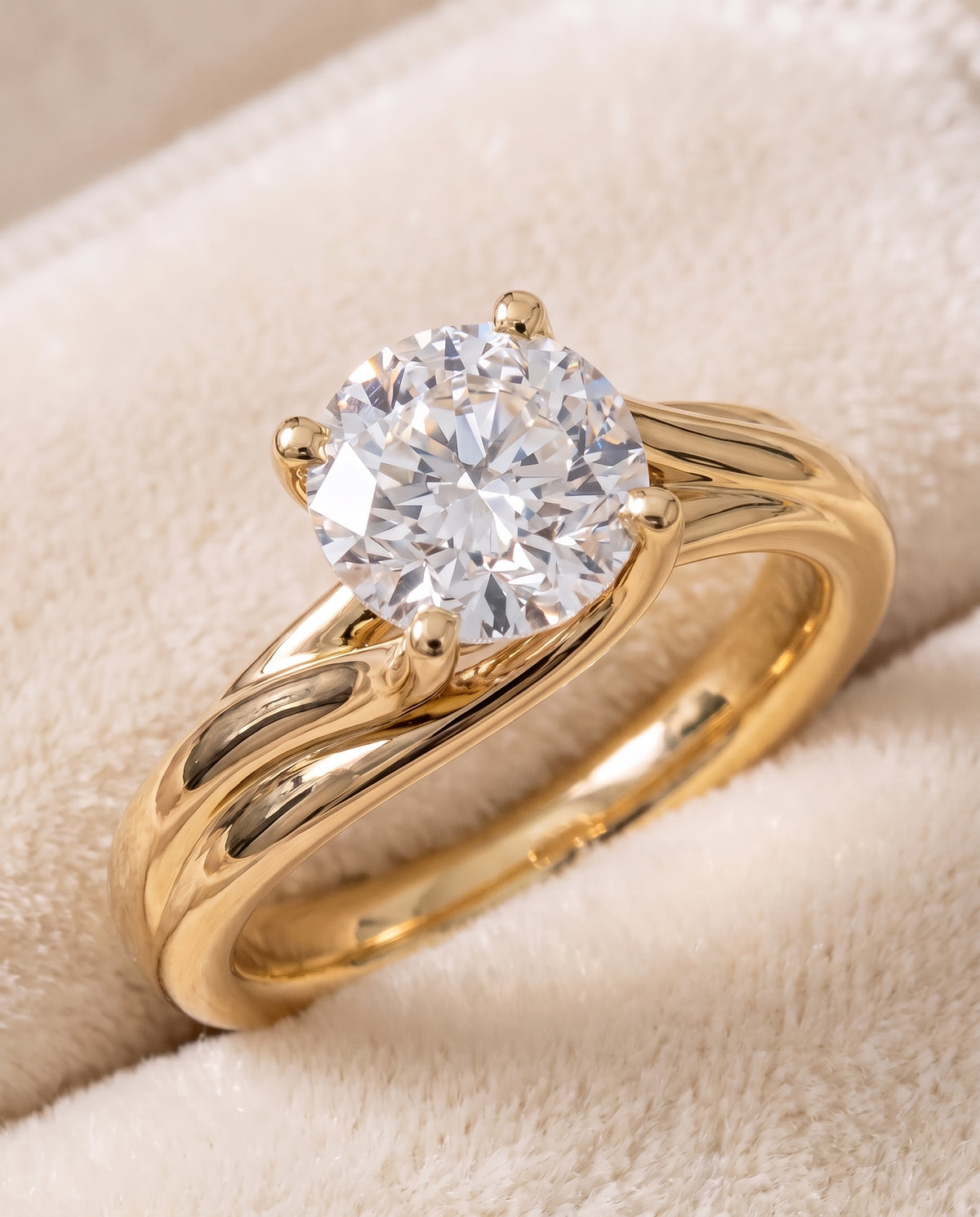 The Joplin Twisted Bypass Solitaire Round Engagement Ring Setting in 18K Yellow Gold