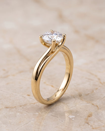 The Joplin Twisted Bypass Solitaire Round Engagement Ring Setting in 18K Yellow Gold
