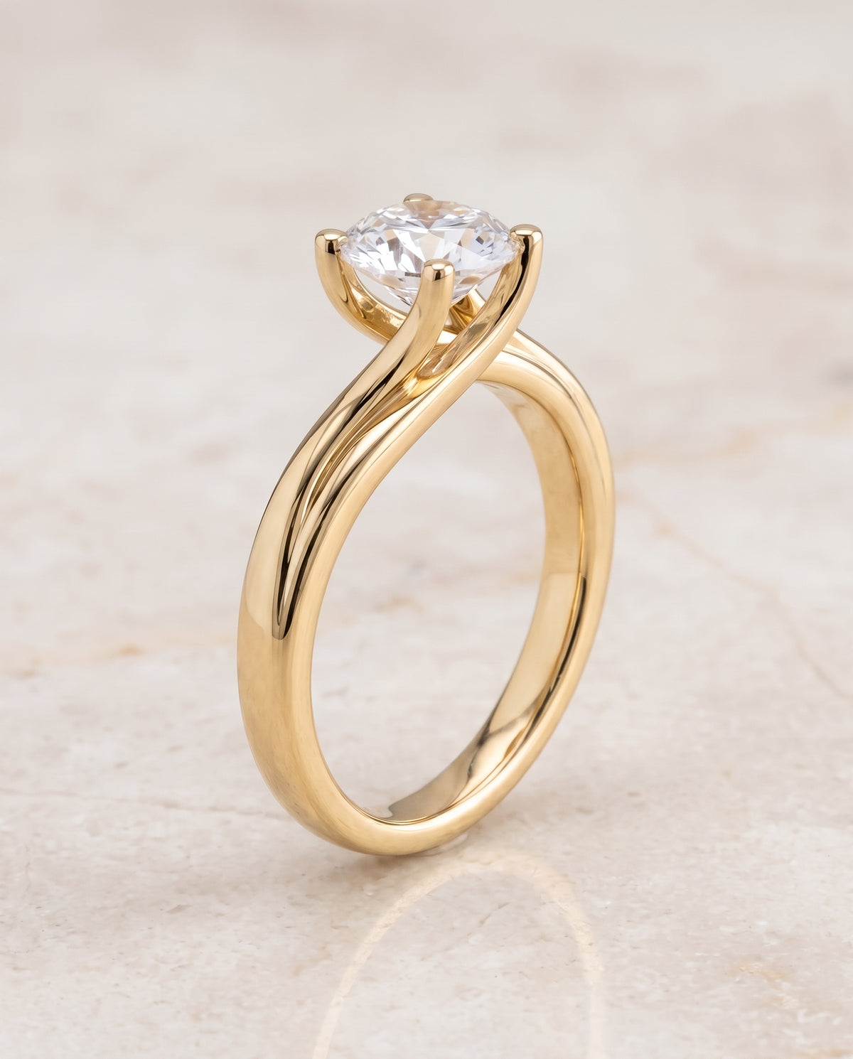 The Joplin Twisted Bypass Solitaire Round Engagement Ring Setting in 18K Yellow Gold