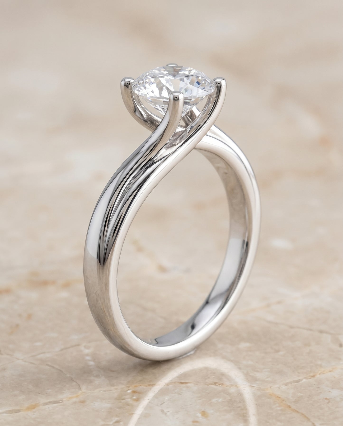 The Joplin Twisted Bypass Solitaire Round Engagement Ring Setting in 18K White Gold