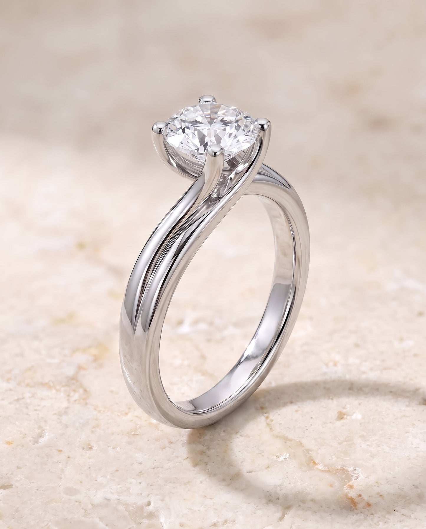 The Joplin Twisted Bypass Solitaire Round Engagement Ring Setting in 18K White Gold