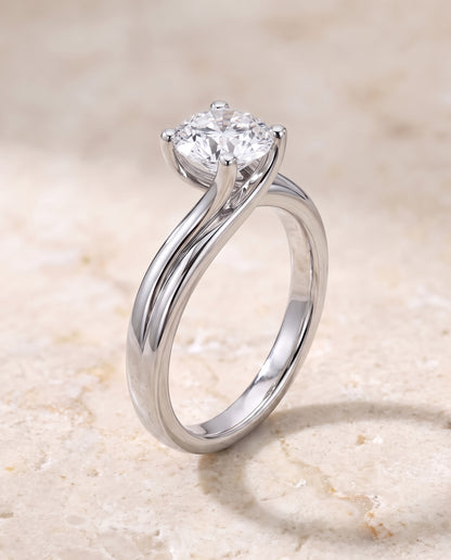 The Joplin Twisted Bypass Solitaire Round Engagement Ring Setting in 18K White Gold