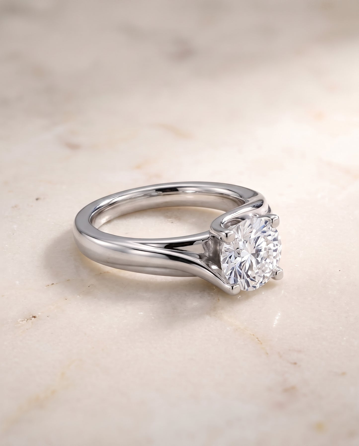 The Joplin Twisted Bypass Solitaire Round Engagement Ring Setting in 18K White Gold