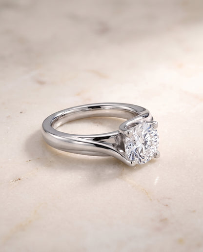 The Joplin Twisted Bypass Solitaire Round Engagement Ring Setting in 18K White Gold